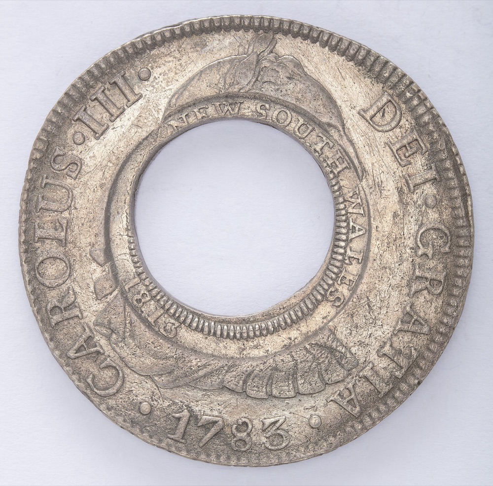 1813 New South Wales Holey Dollar, side with the NEW SOUTH WALES 1813 counterstamp around the hole in a 1783 Spanish dollar — the State Library of New South Wales' example of the same issue; the constituent tracks the issue generally