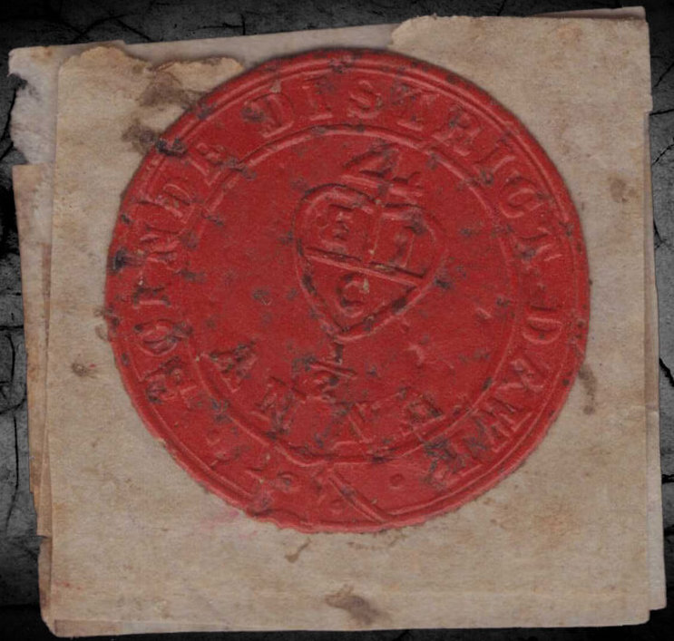 An 1852 Scinde Dawk half-anna embossed red sealing-wax stamp - an exceptional surviving example of the brittle wax issue; ~100 survive in any state.